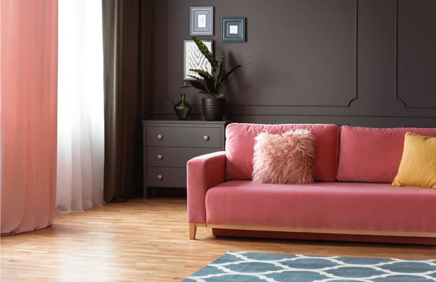 Hot Pink sofa with grey wall