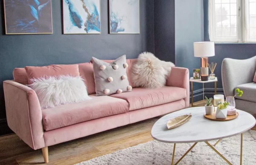 Pale Pink sofa in front of grey wall